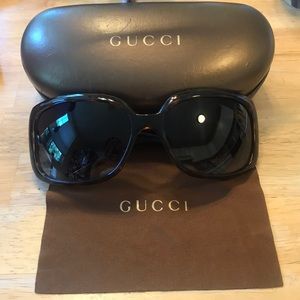 Gucci sunglasses, case, and cloth